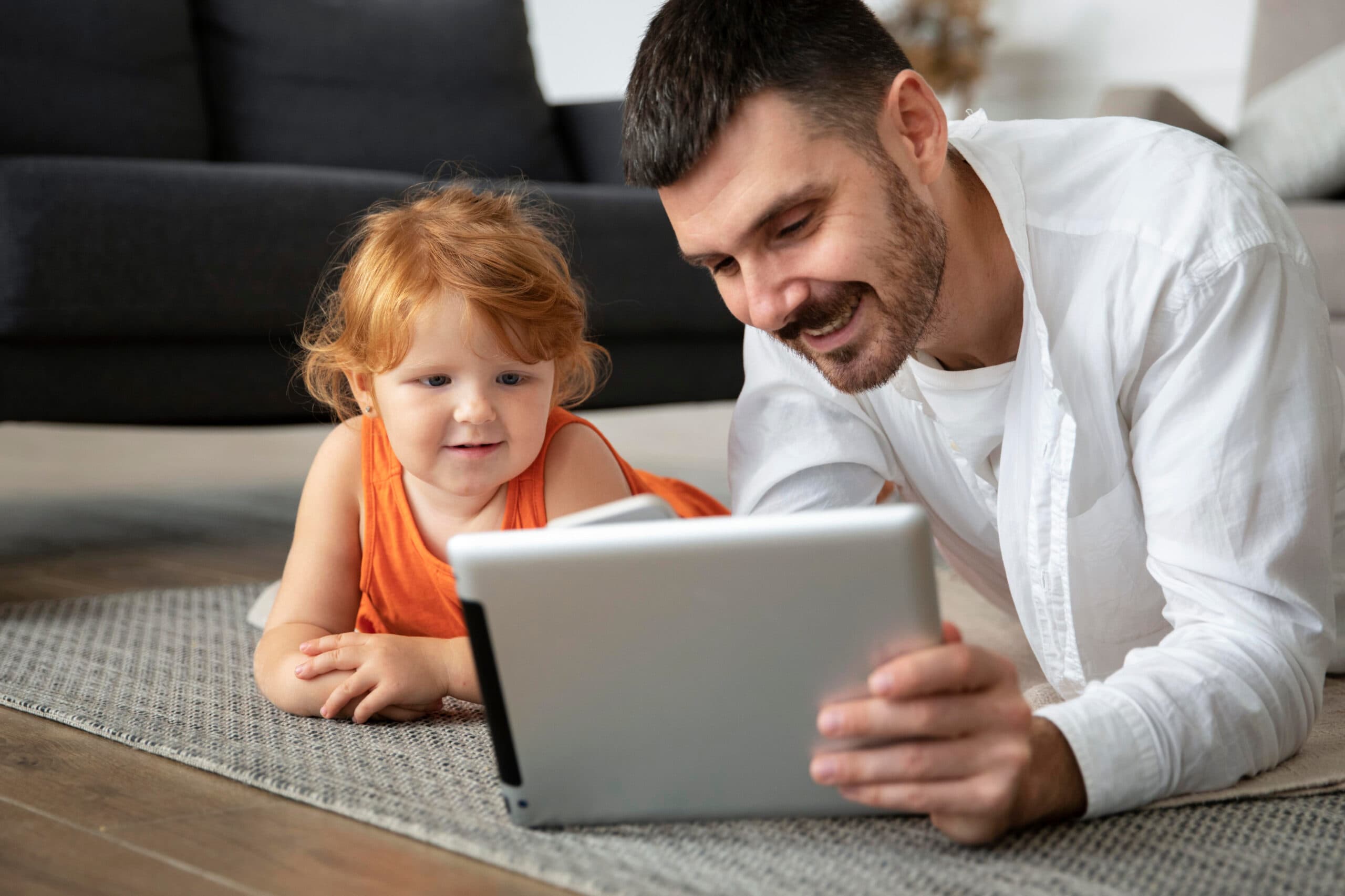 A person teaching a toddler