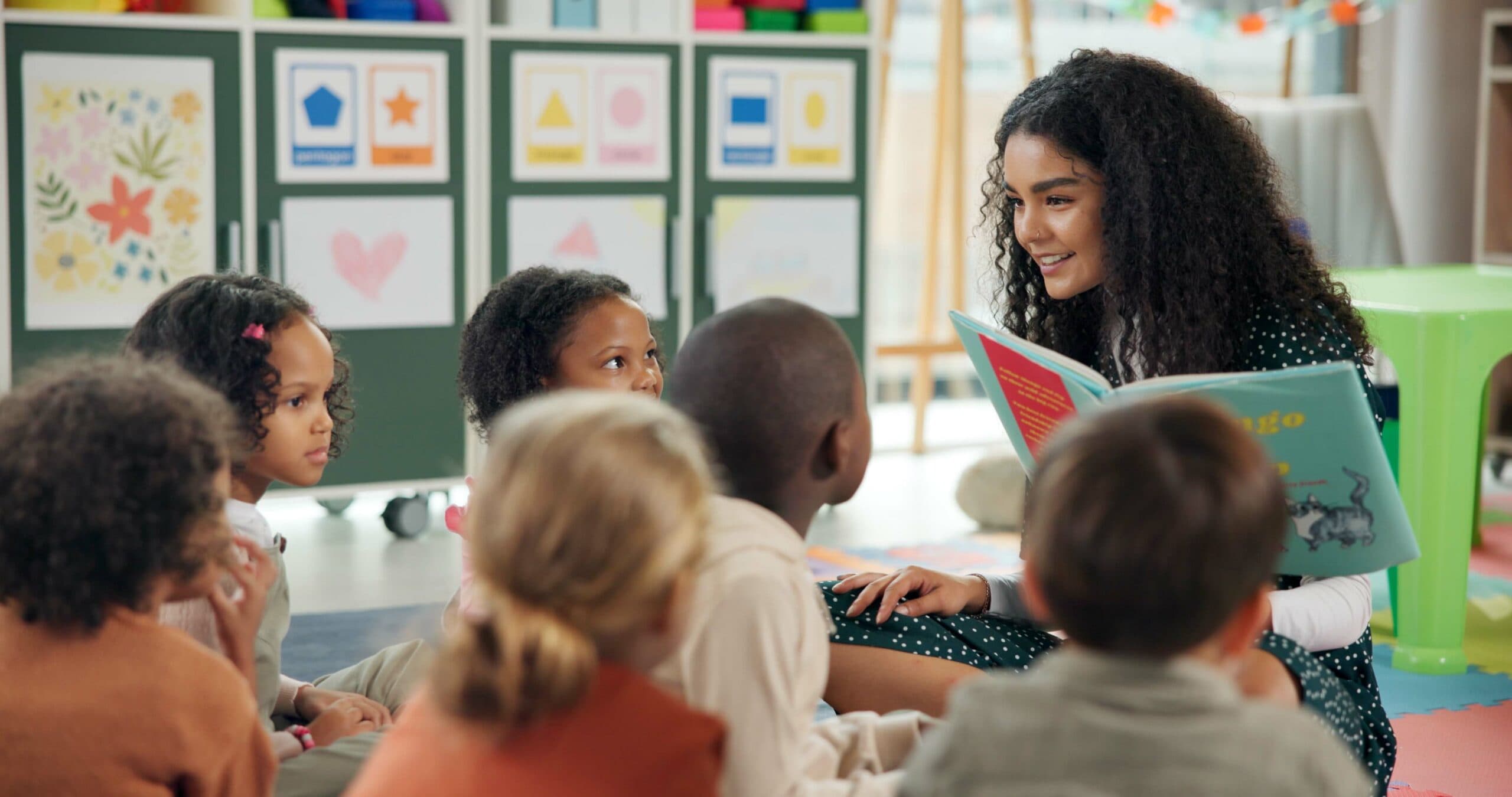 A teacher instructing a group of children